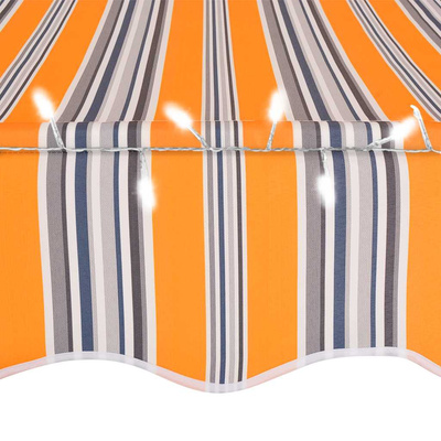 Ręcznie zwijana markiza z LED, 300 cm, żółto-niebieska
